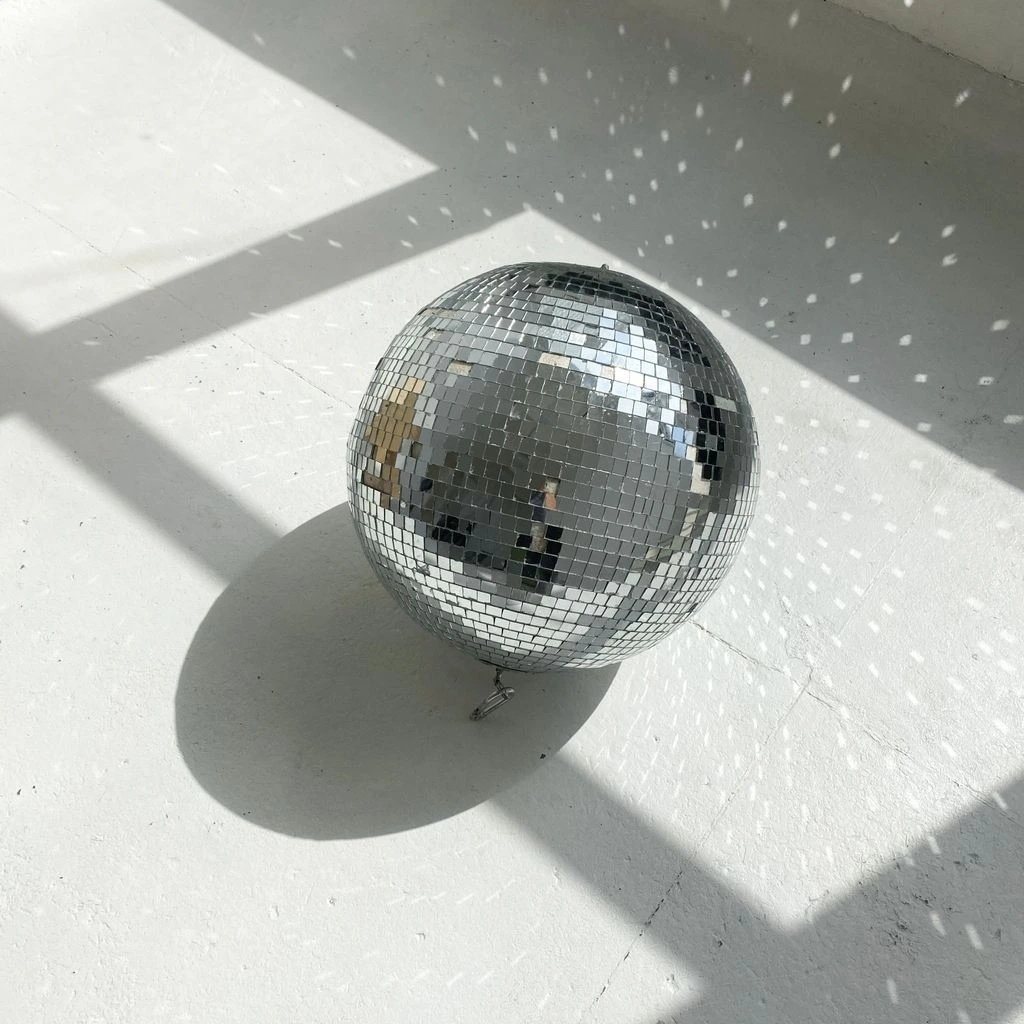Illustration of the Disco bingo room with glitterball and retro dance floor